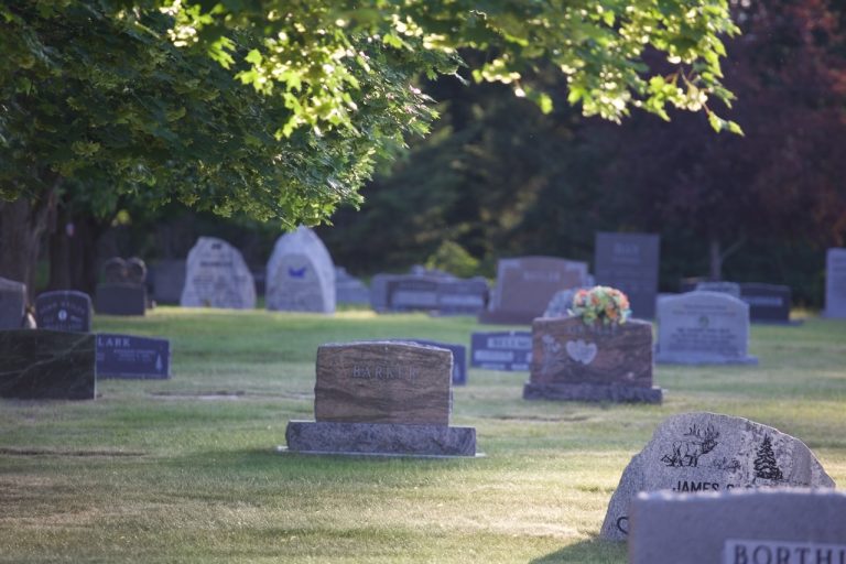Upright headstones in morning light