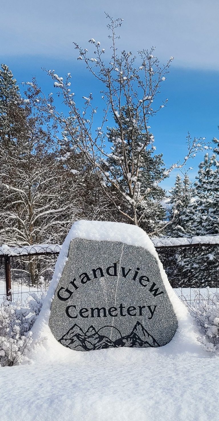 The Grandview Cemetery stone under winter snow