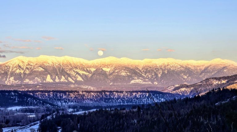 Morning light on the snowy mountains seen from Grandview Cemetery